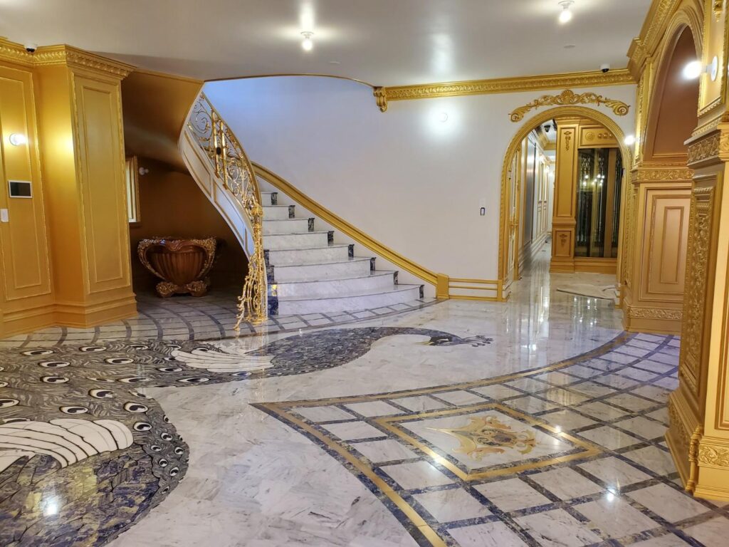 Art display in entry foyer by Andrea D'Alessio